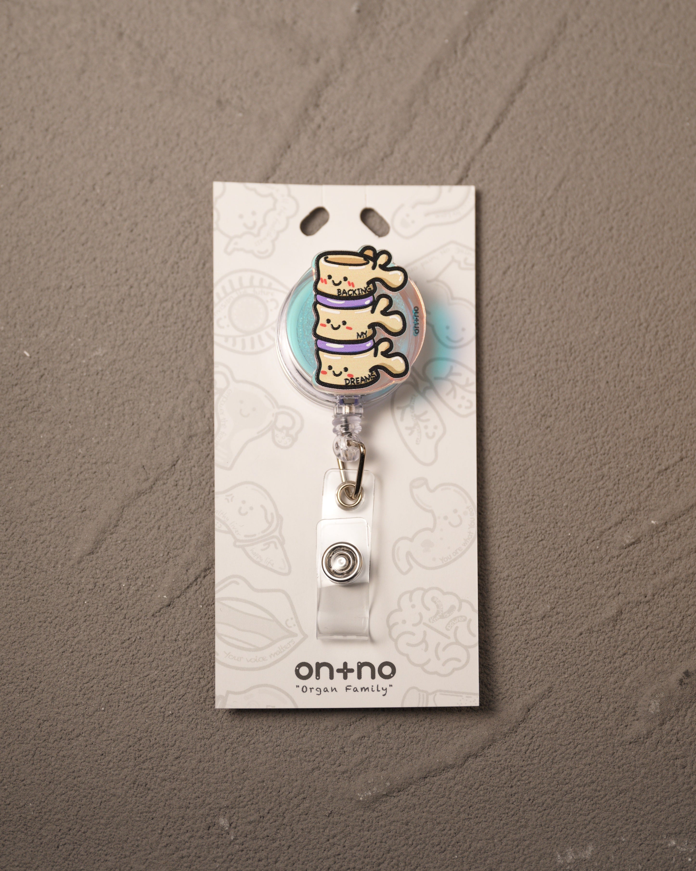 Retractable badge reel - The Spinal Triplets