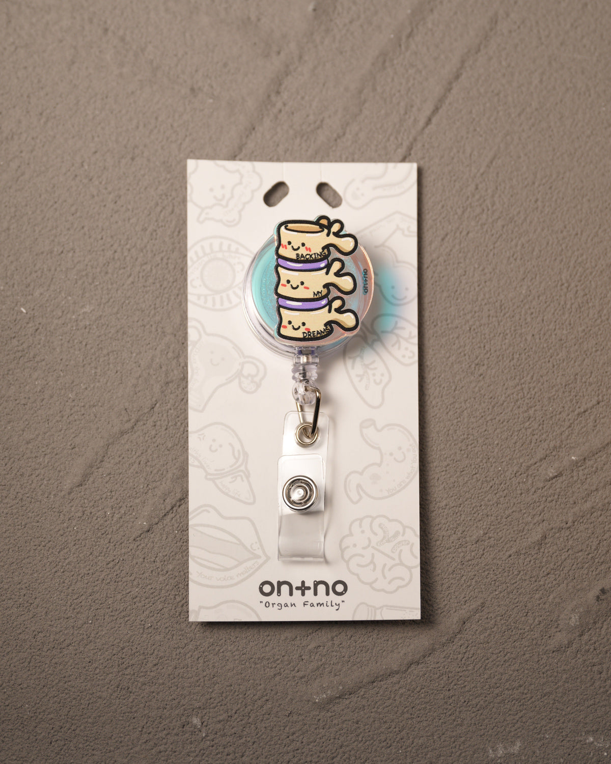 Retractable badge reel - The Spinal Triplets